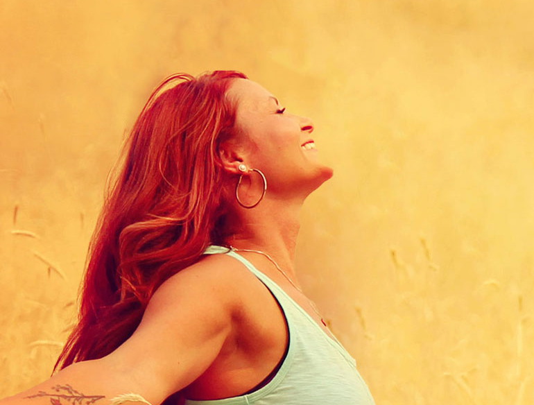 Woman embracing dusk outdoors