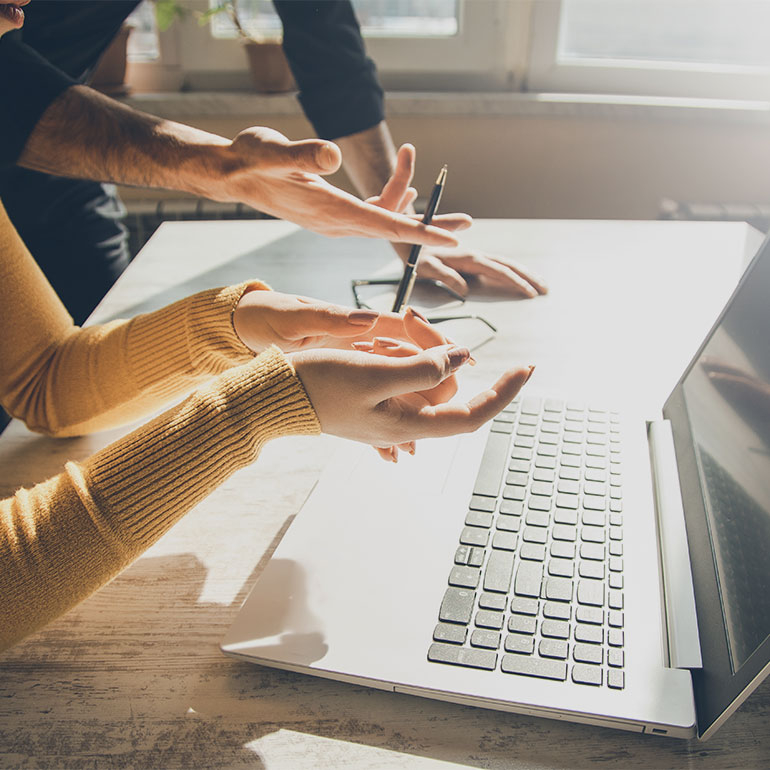 Discussing on laptop